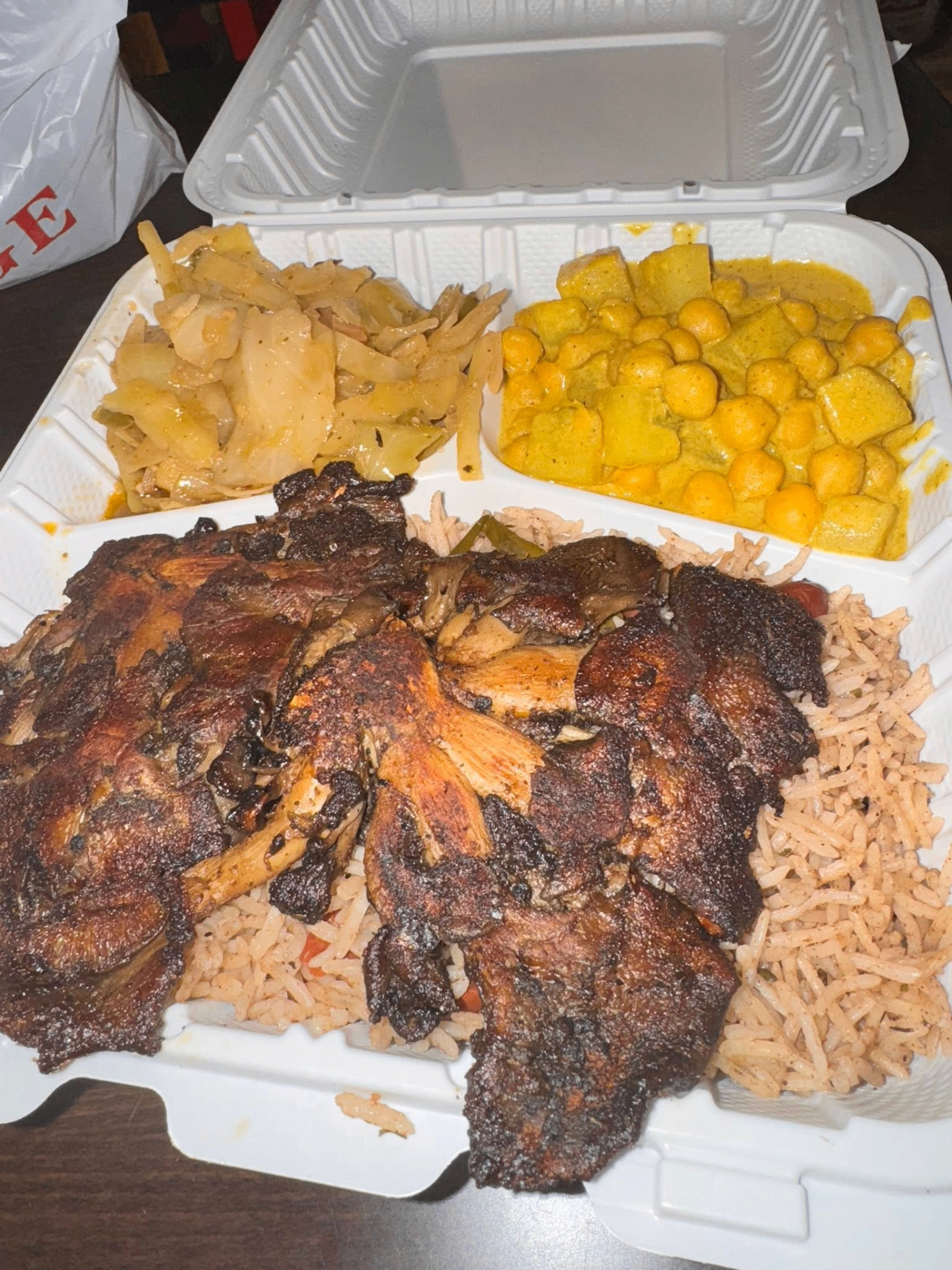 Jerk plate with rice, cabbage and curry chickpeas