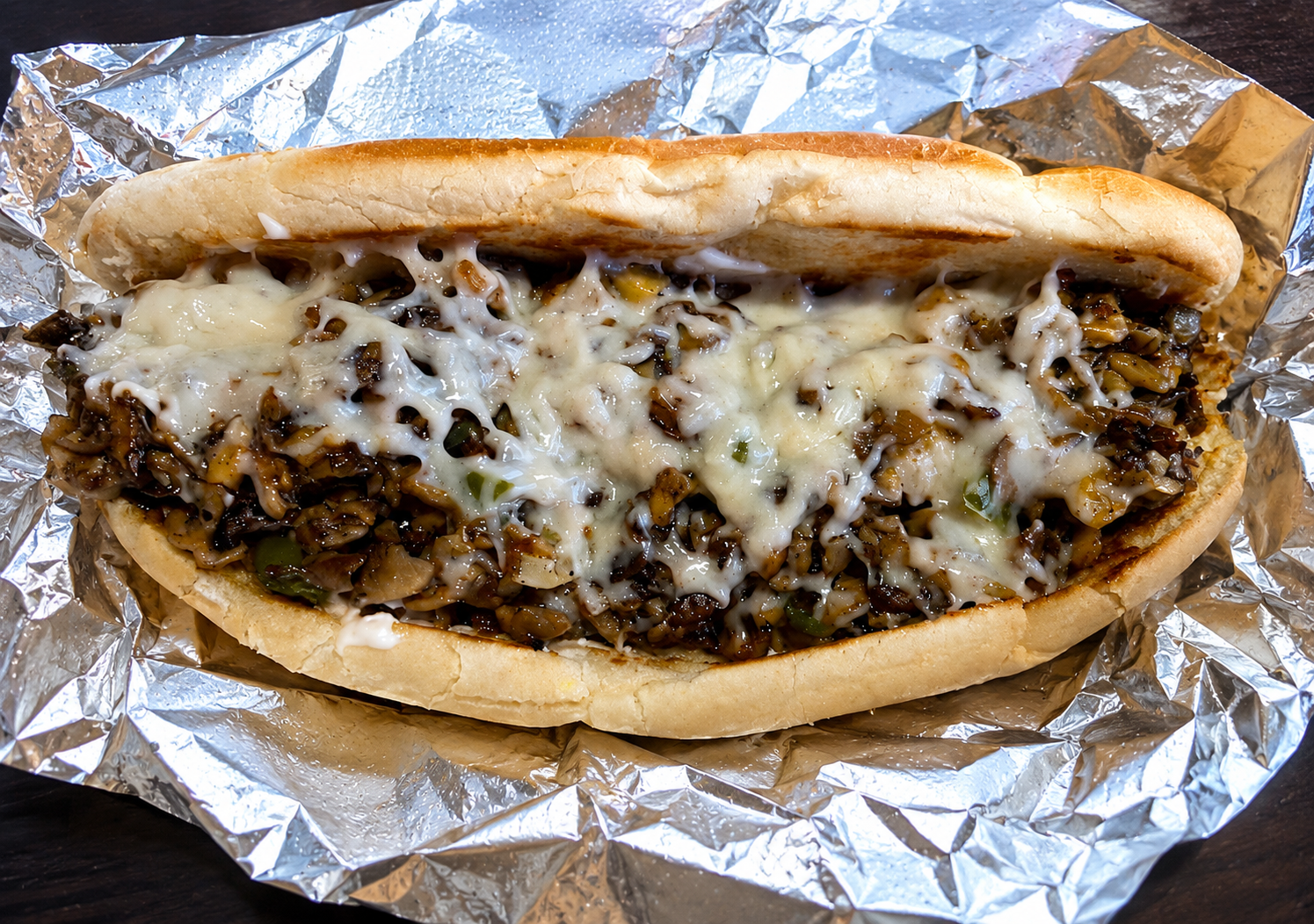 Vegan Philly cheesesteak grinder with mushrooms and melted cheese